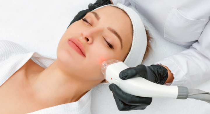 woman getting laser treatment on face